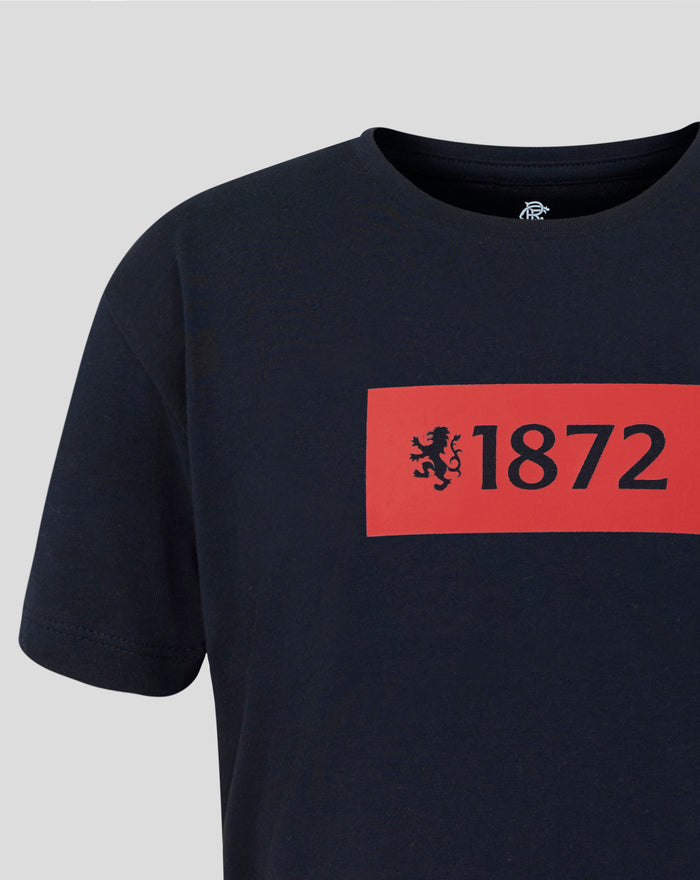 Navy t shirt front displays a bold red 1872 rectangle with a lion crest.