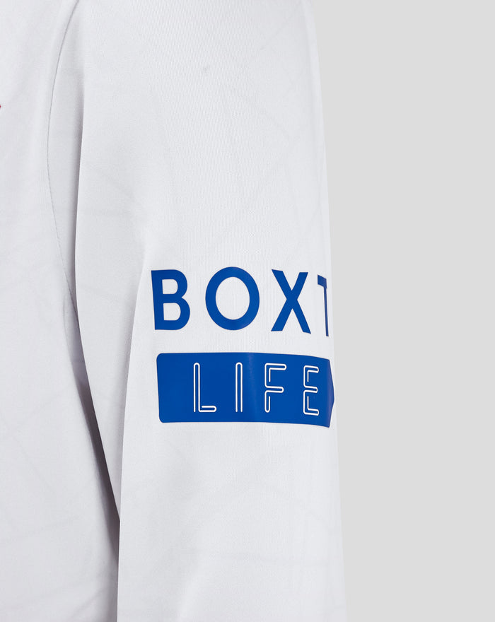 Sleeve close up of white Rangers away jersey with blue patch displaying LIFE text on the lower arm