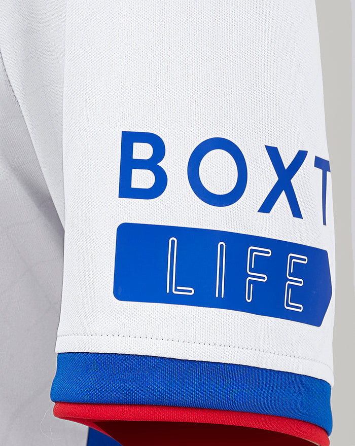 Close up of a white Rangers away jersey sleeve with a blue BOX LIFE graphic
