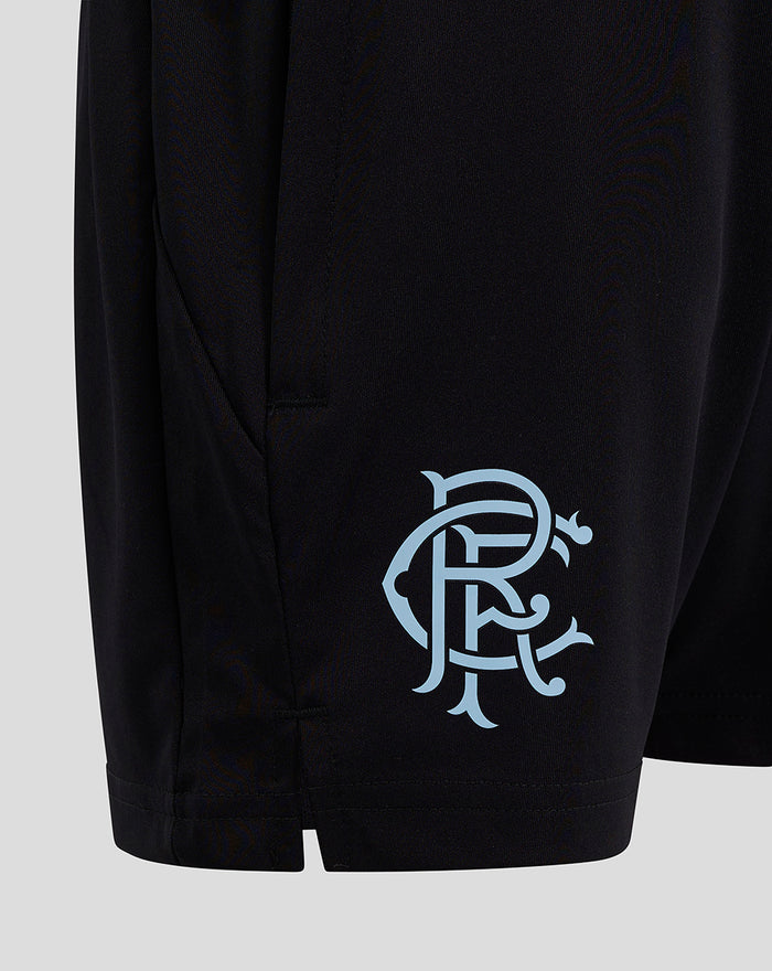 Close up of black shorts showing a light blue crest on the left thigh near the hem