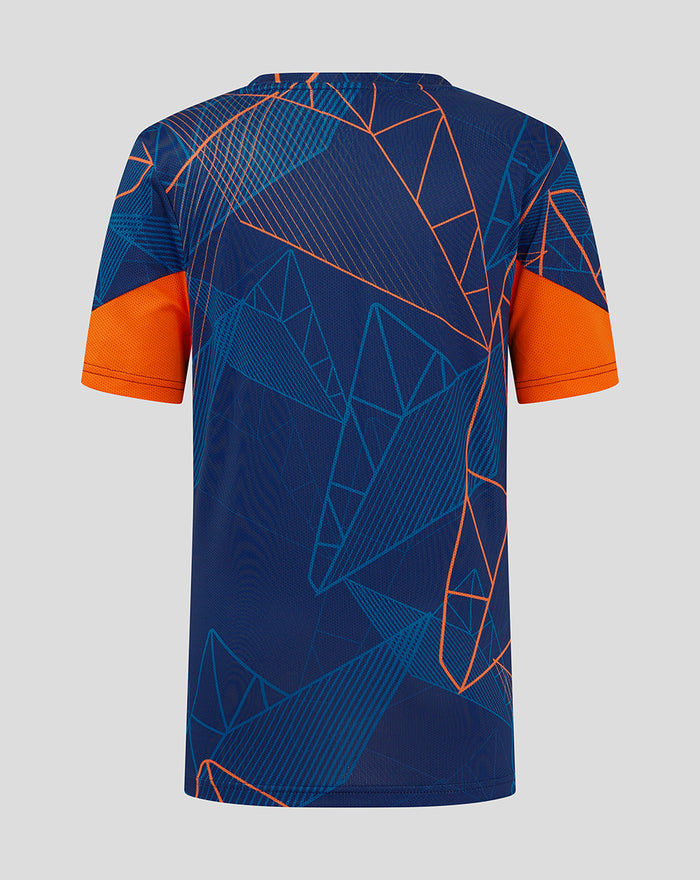 Back view of junior league matchday T shirt in navy with orange geometric lines and orange sleeves