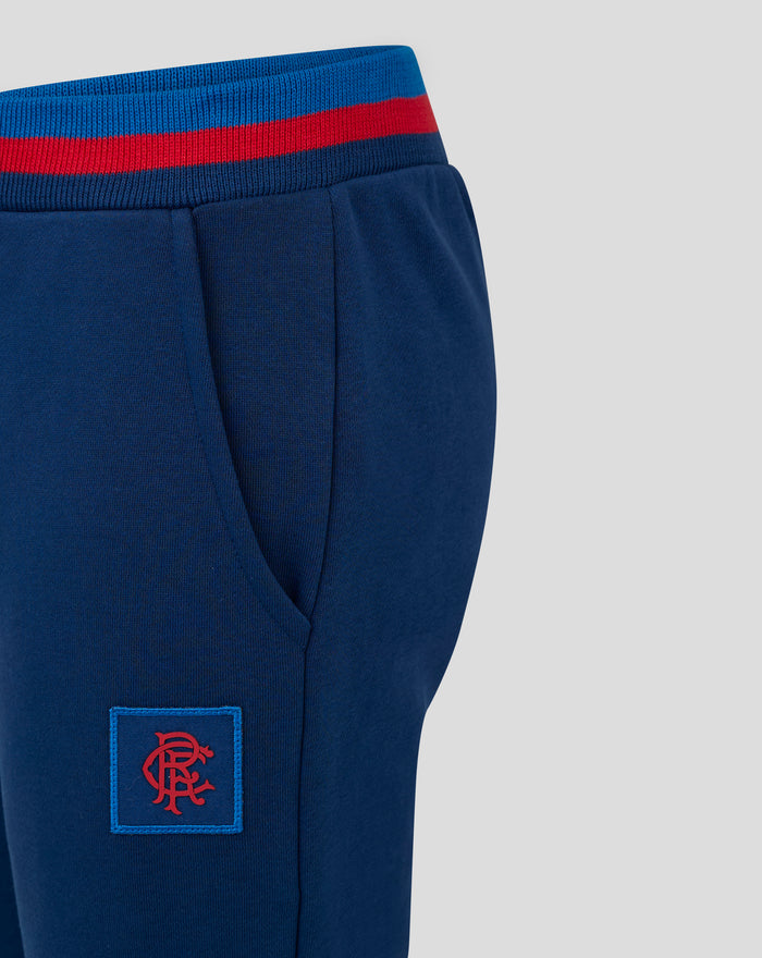 Back view of JUNIOR CLASSIC RANGERS JOGGERS in navy showing blue waistband with a red stripe and crest logo near the hip