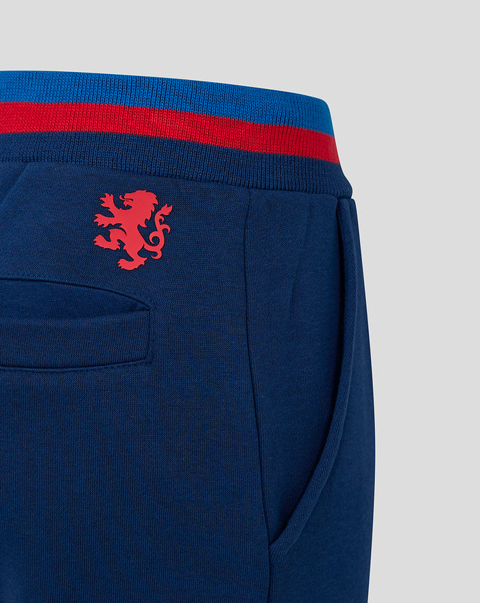Close up of JUNIOR CLASSIC RANGERS JOGGERS in navy with a red lion emblem near the back pocket