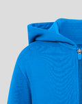 Close up of blue hoodie with hood edge and zipper and red stripe detail at the waistband