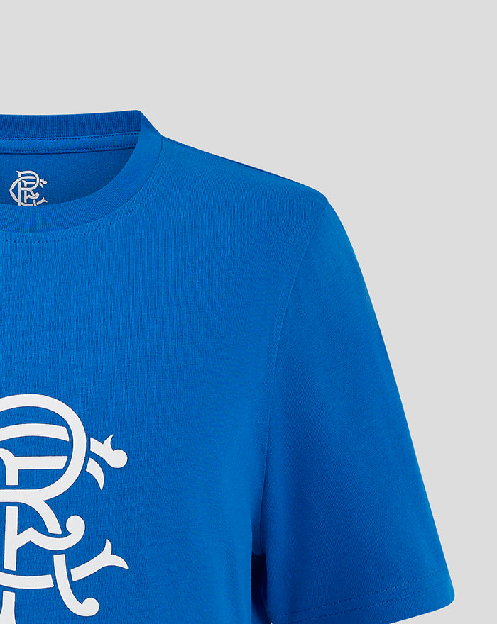 Back view of blue Junior Crest T shirt focusing on the neckline with a small white crest logo visible.