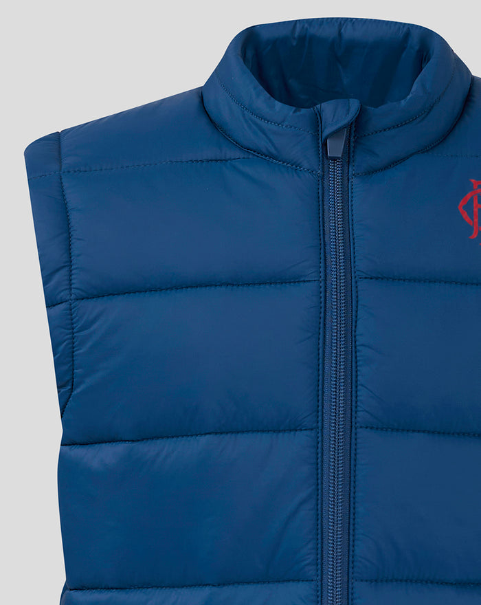 Navy padded vest chest view with center zipper and quilted panels and partial red logo.