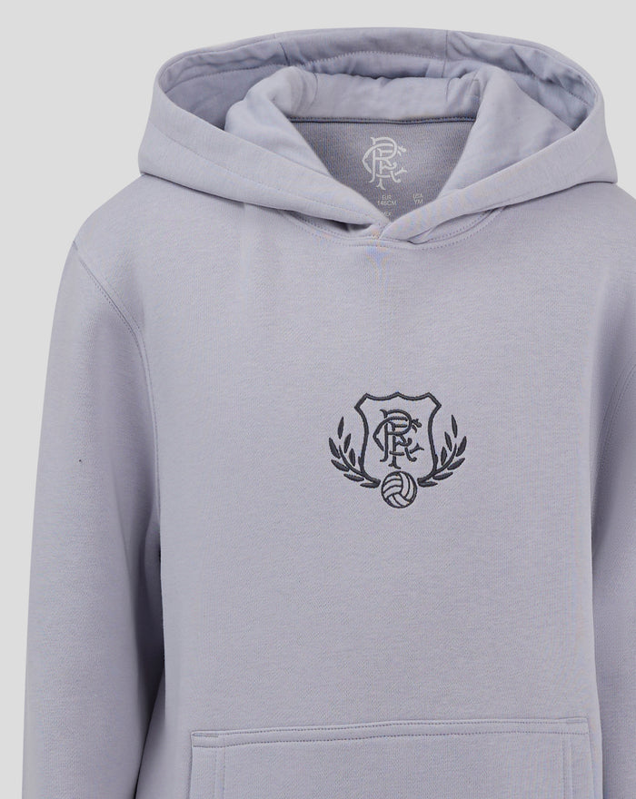 Front view of light blue hoodie with crest emblem on the chest and a large front pocket