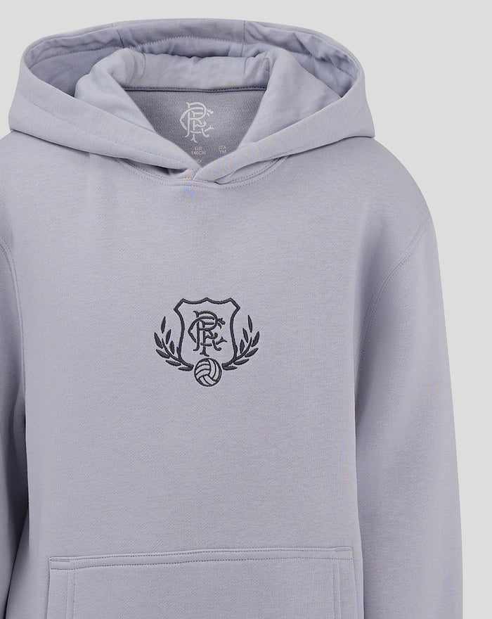 Light blue junior hoodie with a dark crest logo on the chest and a front pocket