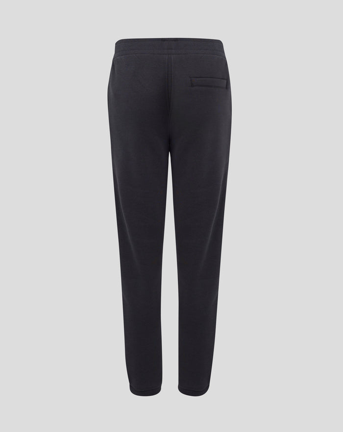 Rear view of dark brown joggers with ribbed cuffs at the ankles