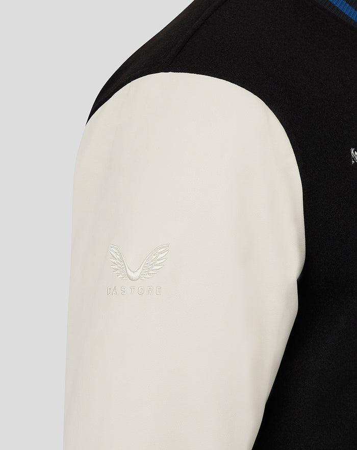 Cream sleeve on a black varsity jacket with Castore embroidery