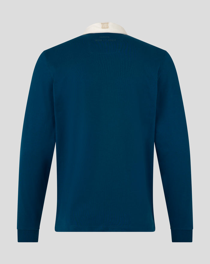 Back view of teal heritage polo showing the Ibrox anniversary embroidery across the upper back.