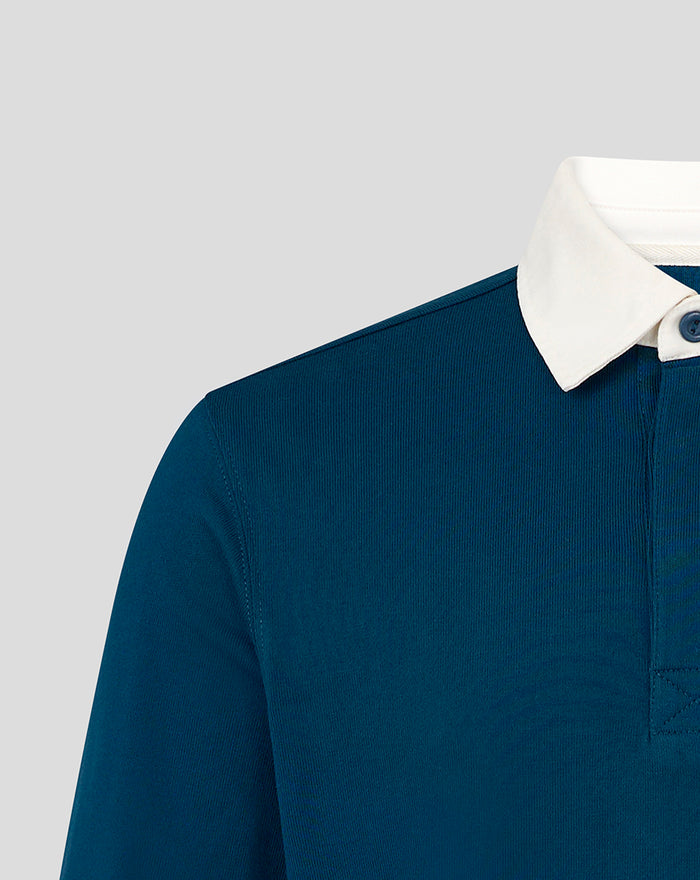 Partial front view of blue Rangers heritage polo highlighting white collar and chest crest embroidery