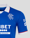 Rangers blue home shirt close-up with left chest crest, right chest Umbro logo, UNIBET sponsor across the front, white collar with red trim