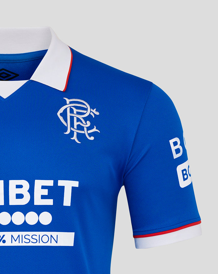 Rangers blue home shirt close-up with left chest crest, right chest Umbro logo, UNIBET sponsor across the front, white collar with red trim