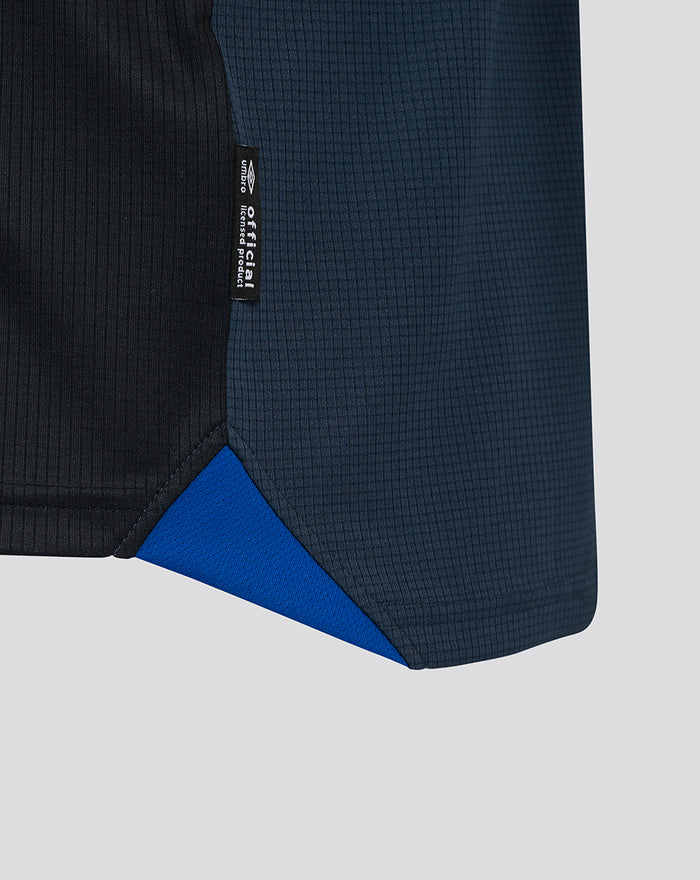 Close up of Rangers FC Pro Third shirt showing textured fabric and a dark blue panel with a small hem label