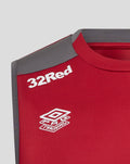 Front view of rhythmic red men's training vest with 32Red and OG Training logos on the chest.