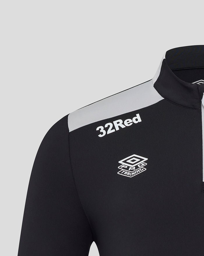 Shoulder view of black training top with 32Red lettering and Umbro crest and a light grey shoulder panel