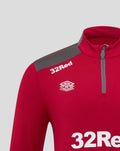 Close up of red men's training top showing gray shoulder panel and zipper with 32Red logo and crest.