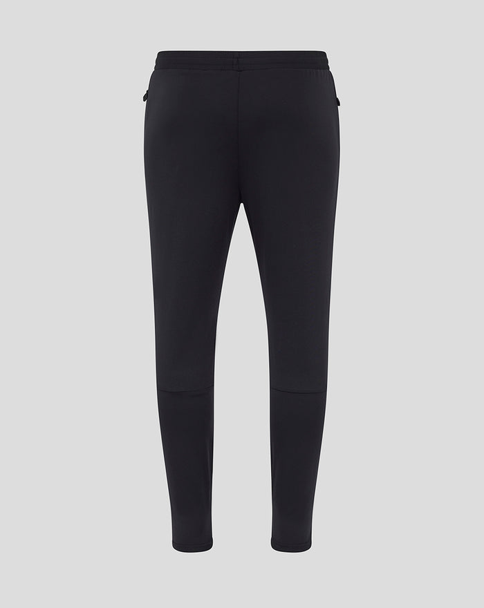 Back view of black men's coaches training knit pants with elastic waistband and tapered legs