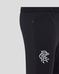 Close-up of black training pants showing side zip pocket and leg logo.