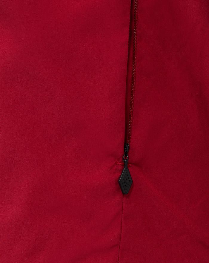 Close up of red junior training packable hooded jacket zipper detail