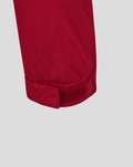 Close up of red jacket cuff with Velcro strap for adjustable fit