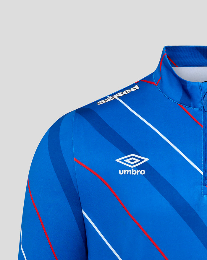 Detail of blue Rangers jersey chest with crest and diagonal stripe pattern.