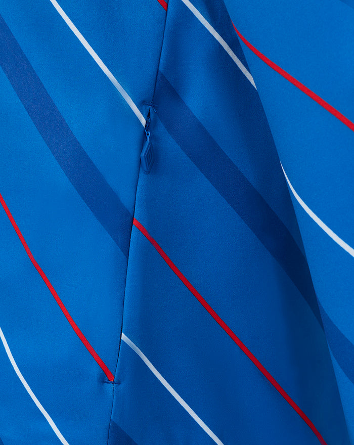 Front zipper detail of blue home matchday jacket with diagonal stripes and reinforced seams.
