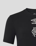 Close up of black Junior 25/26 presentation logo T-shirt showing white Umbro diamond and club crest on the chest.