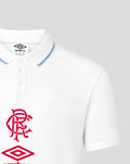 Close-up of white polo collar with blue trim showing red crest on chest and part of the Umbro logo