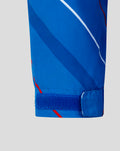 Close up of the sleeve cuff on a blue matchday shower jacket with a Velcro strap and diagonal stripes