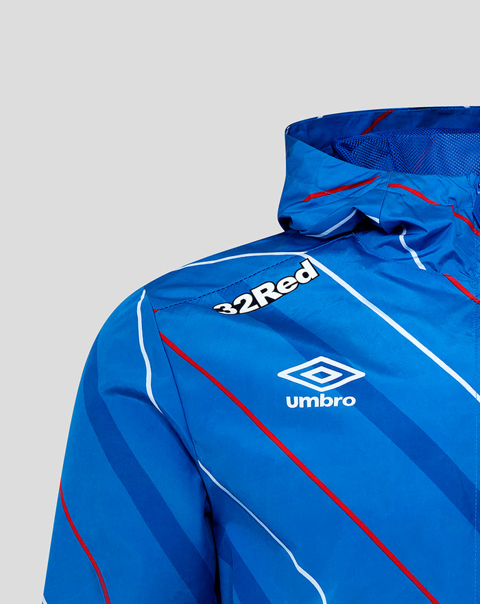 Close-up of blue packable shower jacket chest showing 32Red sponsor and Umbro logo