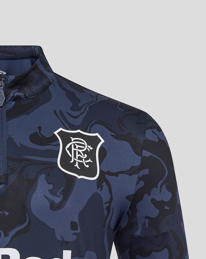 Close-up of navy camouflage unisex quarter zip top showing the club crest and Umbro logo on the chest