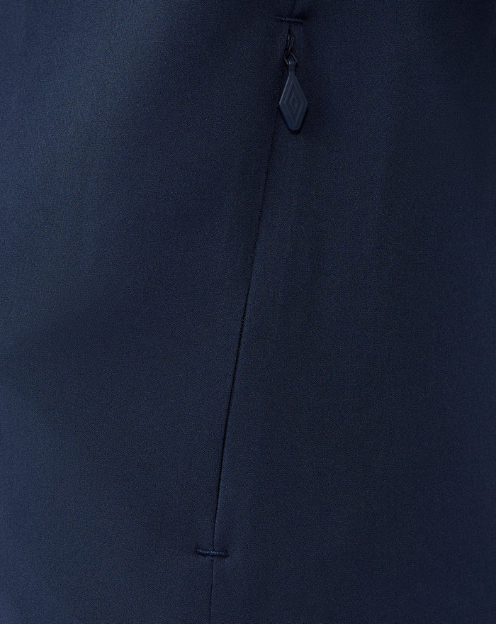 Close up of navy fabric on the Third Matchday jacket highlighting a vertical zip pocket and zipper pull