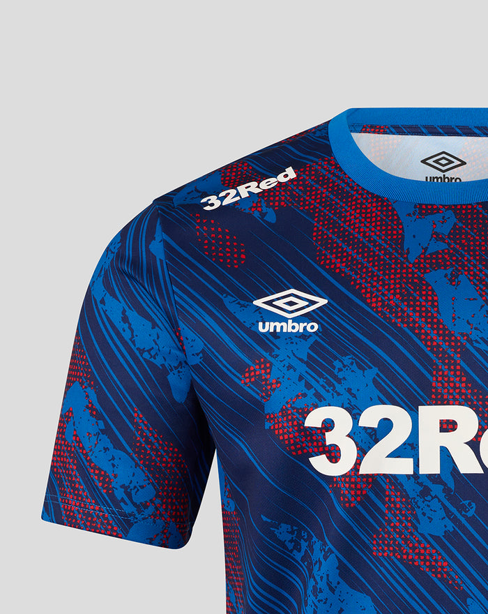 Close up of blue Rangers Armed Forces Day tee showing Rangers crest and Umbro logo with 32Red sponsor on the chest