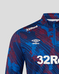 Shoulder close up of Rangers Armed Forces Day top showing 32Red sponsor and Umbro diamond on blue red print