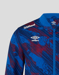 Shoulder and chest view showing 32Red and Umbro logos on the blue red print jacket with zip puller and collar