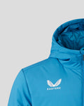 Close-up of chest area on blue training jacket showing Castore branding and shoulder seam.