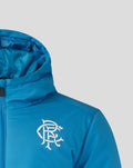 Blue training jacket with white club crest on the left chest and hood visible.
