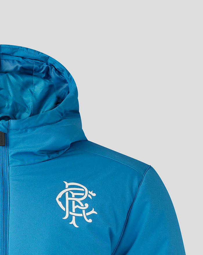 Blue training jacket with white club crest on the left chest and hood visible.