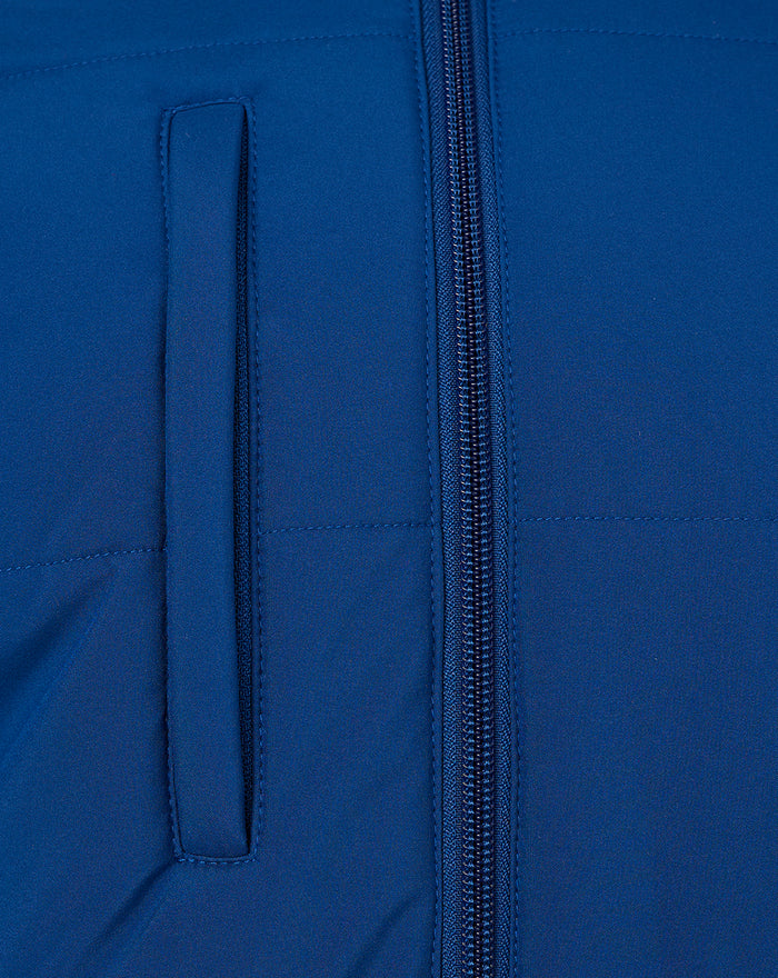Close-up of blue puffer jacket showing front zipper and vertical pocket opening