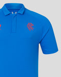 Close-up of blue polo showing Castore logo on the chest and the club crest on the other chest.