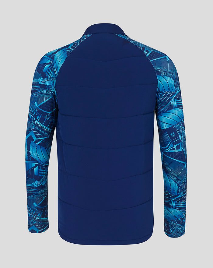 Back view of navy City Print Hybrid Jacket with quilted panels and blue graphic sleeves