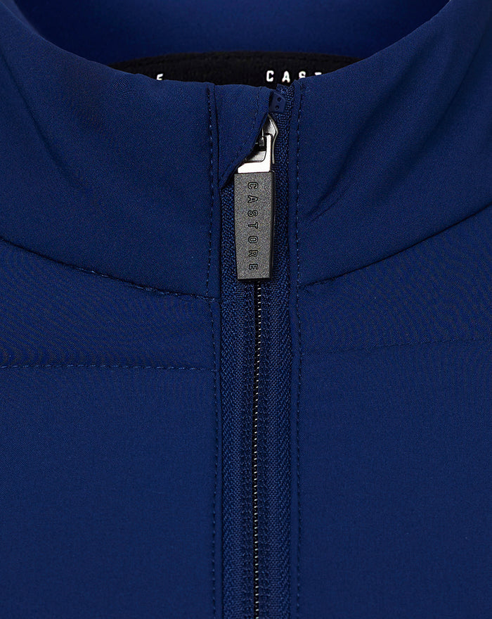 Close up of the jacket neck showing the zipped collar with Castore branded pull