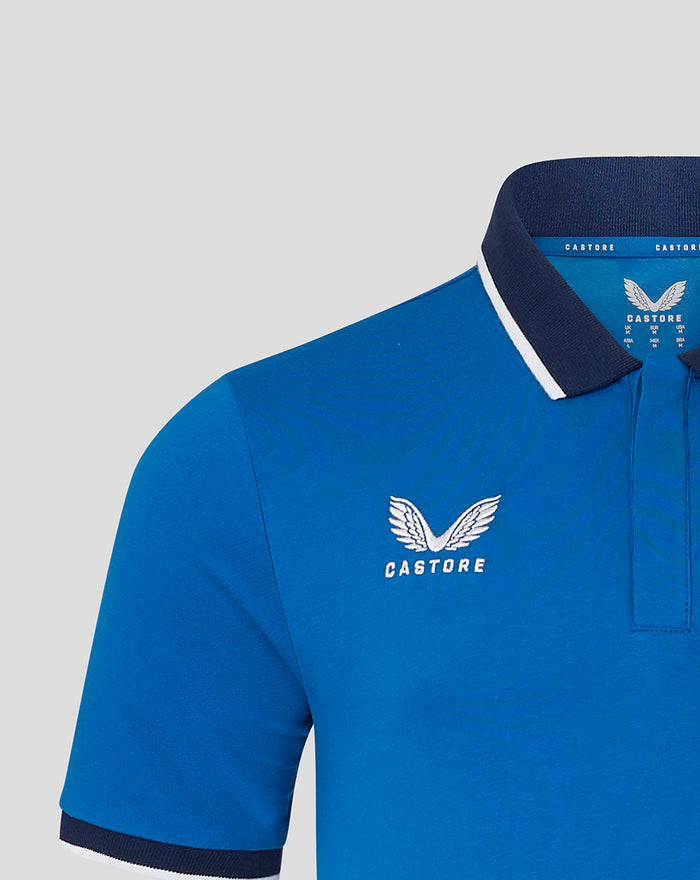 Blue polo with embroidered Rangers crest on left chest and Castore branding visible at interior collar