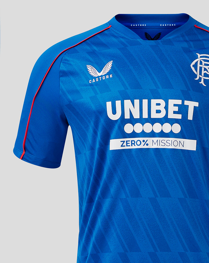 Front close up of Rangers home shirt showing crest on the left chest and the UNIBET sponsor lettering