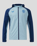 Front view of Rangers Pro Players Training Rain Jacket in light blue with navy sleeves hood and left chest crest.