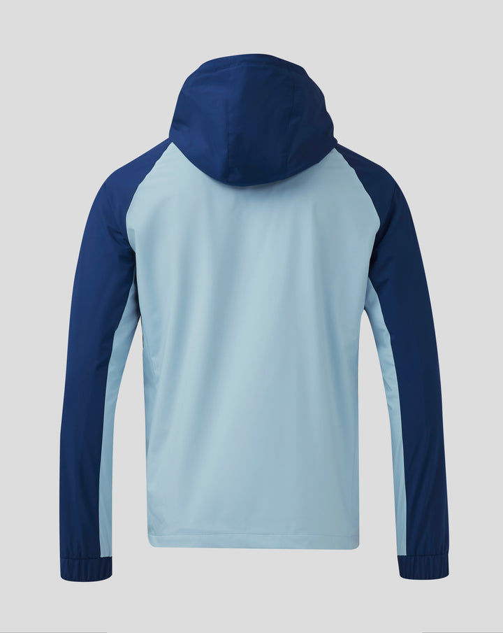 Back view showing navy hood and color-blocked shoulders on light blue Rangers training jacket