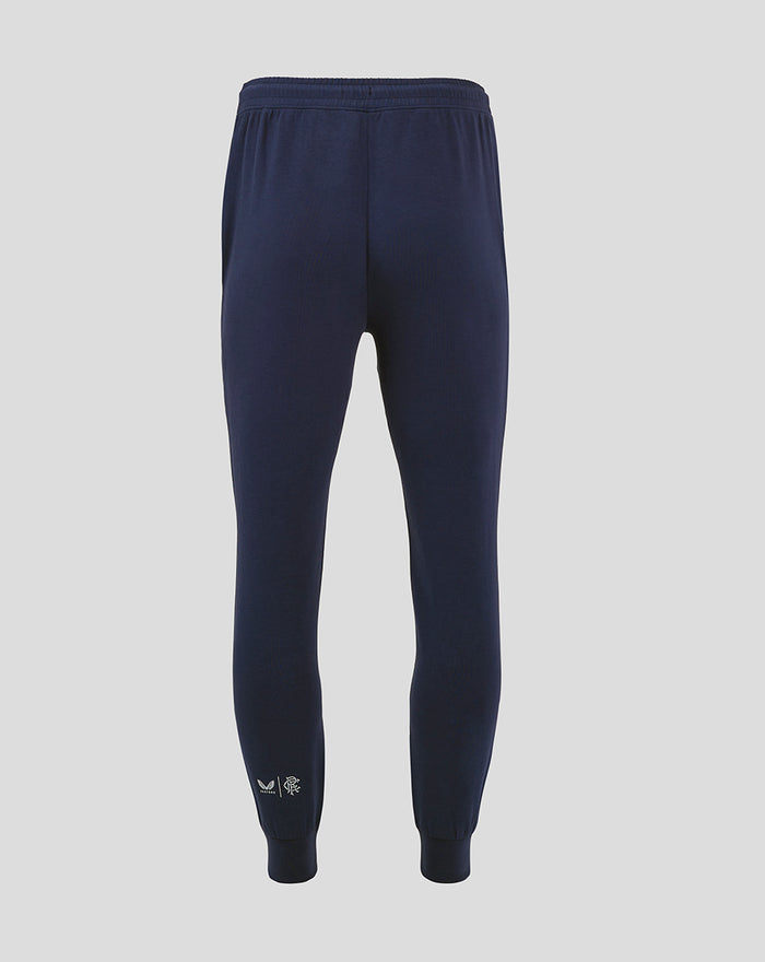 Back view of navy Rangers FC Travel Pant showing ribbed cuffs and small white logo at ankle.