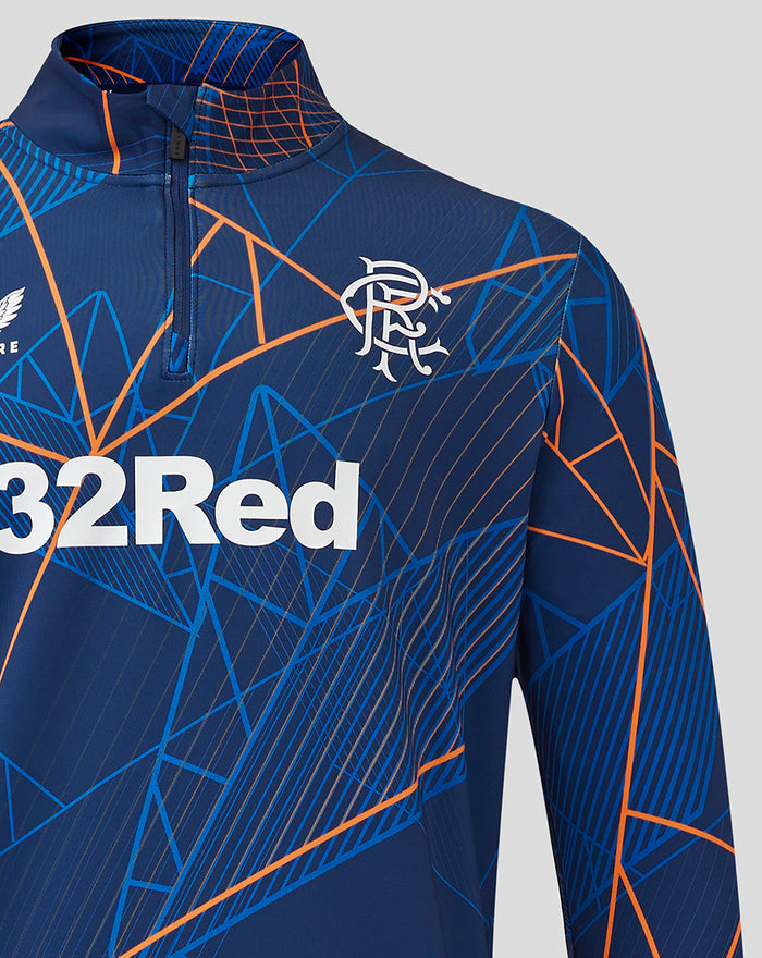 Blue Rangers Matchday midlayer with orange geometric print and 32Red across the chest plus crest embroidery